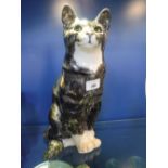 A WINSTANLEY CERAMIC MODEL OF A SEATED CAT