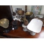 A SET OF VINTAGE ENAMEL KITCHEN SCALES with weights and two similar