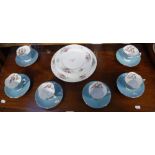 A SET OF SIX AYNSLEY PALE BLUE AND FLORAL DECORATED TEA CUPS AND SAUCERS with six 'Howard Sprays'