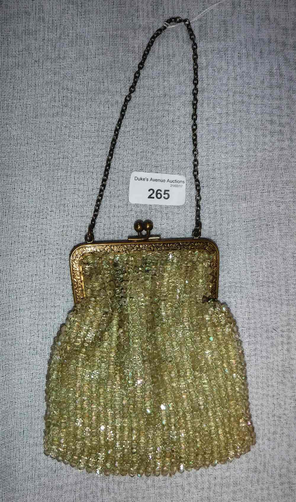 A BEADWORK PURSE with metal clasp