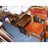 A 17TH CENTURY STYLE SPANISH CHAIR with leather sling seat and back, a nest of oak tables, a