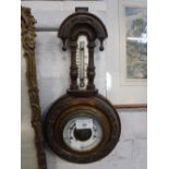 A VICTORIAN WALNUT CASED BAROMETER