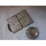 A SILVER CIGARETTE CASE embossed with flowers and foliage and an ashtray (2)