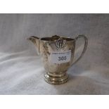 A SILVER CREAM JUG