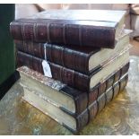 A NOVELTY ICE-BUCKET in the form of a pile of leather and marble paper bound books