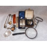 A SILVER NAPKIN RING in a fitted presentation case and a collection of similar items