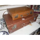 A VINTAGE LEATHER SUITCASE and a similar briefcase