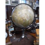A TERRESTRIAL GLOBE ON STAND: The globe surface with a number of applied patches, with a graduated