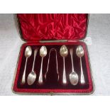 A SET OF SIX SILVER TEASPOONS and a tong in a fitted presentation case