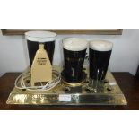 GUINNESS: TWO VINTAGE ILLUMINATED PINTS OF GUINNESS, to sit in front of beer pumps, another