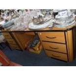 A MODERN 'ART DECO' STYLE KNEEHOLE DESK in pale beech with ebonised edges 71" wide