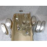 A SILVER-BACKED DRESSING TABLE SET and a collection of silver topped jars