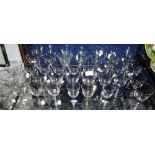 A LARGE COLLECTION OF DRINKING GLASSES with faceted stems