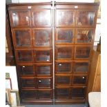 A PAIR OF GLOBE-WERNICKE STYLE MAHOGANY SECTIONAL BOOKCASES each section with double doors 24"