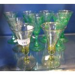 A SMALL COLLECTION OF GREEN GLASS WINE GLASSES