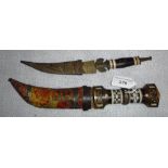 A SHORT DAGGER with inlaid handle and scabbard and another similar