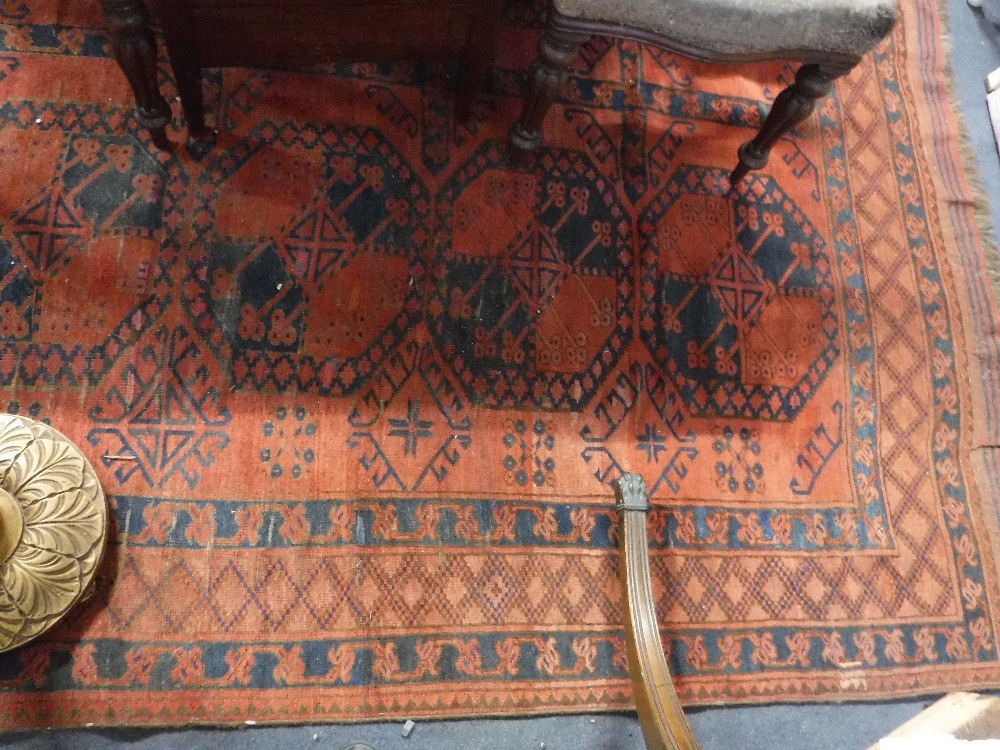A LARGE RED WASHED BOKHARA TYPE CARPET approx. 118" x 162"