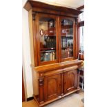 A VICTORIAN MAHOGANY LIBRARY BOOKCASE with glazed upper section over arched panelled doors 56.5"