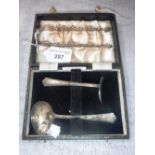 A SILVER CHRISTENING SET in a fitted leatherette case and a pair of tongs (2)