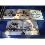 FIVE DELFT TILES decorated with buildings and other subjects