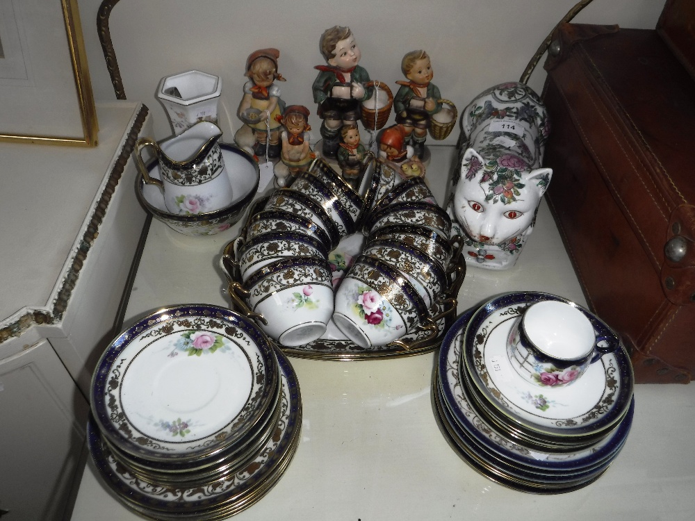 A COLLECTION OF GOEBEL 'HUMMEL' FIGURES, a Chinese ceramic cat, a Noritake teaset and other items