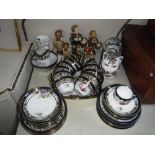 A COLLECTION OF GOEBEL 'HUMMEL' FIGURES, a Chinese ceramic cat, a Noritake teaset and other items