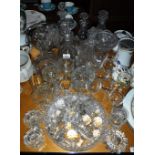 A COLLECTION OF CUT-GLASS DECANTERS, stoppers and mixed glassware