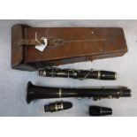 A CLARINET in leather case, the clarinet stamped 'Excelsior Sonoris..... RME 619'