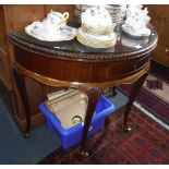 A GEORGE II STYLE MAHOGANY FOLD-OVER TOP DEMI-LUNE TEA TABLE on cabriole legs with gadrooned edge