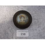 A SMALL SNUFF BOX, the circular lid mounted with a portrait miniature