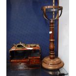 AN ORIENTAL HARDWOOD AND GILT METAL MOUNTED TRAVELLING CASE with twin compartments above short