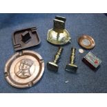 A BAKELITE ASHTRAY, brass match holder and other items