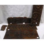 A COLLECTION OF 17TH CENTURY CARVED OAK PANELS and a similar carved head