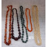 A COLLECTION OF NECKLACES, including 'cherry amber' and pearls