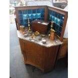 AN EDWARDIAN LIGHT OAK CORNER WASHSTAND with rouge marble top and Arts & Crafts green tiled splash-