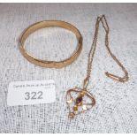 A 9CT YELLOW GOLD BANGLE and a pendant and chain