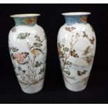 A PAIR OF ORIENTAL VASES, decorated with landscapes, signed underneath, 14.5" high