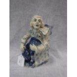 AN ENGLISH STAFFORDSHIRE POTTERY JUG of George Whitfield seated holding his hat and lantern