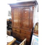 A VICTORIAN MAHOGANY LINEN PRESS with twin panelled doors above four drawers 53" wide