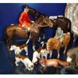 A COLLECTION OF BESWICK FIGURES including a huntsman on horseback, a child on a pony, fox hounds and