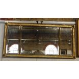 A REGENCY TRIPLE WALL MIRROR within a gilt gesso frame 21" high x 44" wide