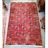 A RED GROUND BOKHARA TYPE RUG, 43" X 65"