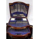 AN EDWARDIAN PLATED CANTEEN in an architectural mahogany case