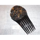 A 'TORTOISESHELL' MANTILLA TYPE COMB with carved and pierced decoration