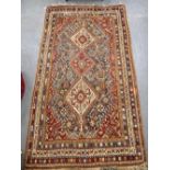 AN AFGHAN TYPE RUG with all over geometric pattern, 60" x 112"