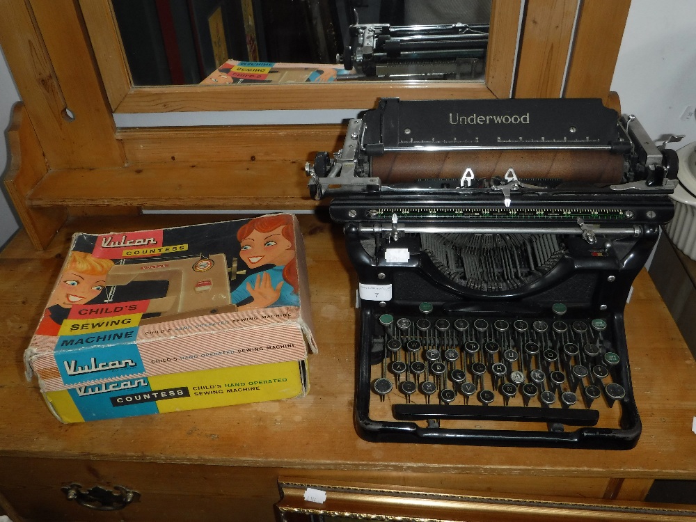 A 'VULCAN COUNTESS' CHILD'S SEWING MACHINE (boxed) and a vintage Underwood typewriter