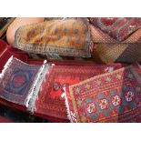 AN AFGHAN CARPET FACED BAG, 38" X 19" and three small rugs