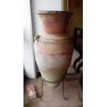 A PAIR OF LARGE TERRACOTTA OLIVE JARS on metal stands, 42" high overall