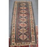 A BLUE GROUND TRIBAL RUG, the border decorated with stylised birds (signed) ,40" x 90''