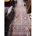 A LARGE RED GROUND PERSIAN DESIGN CARPET, 160" x 127"